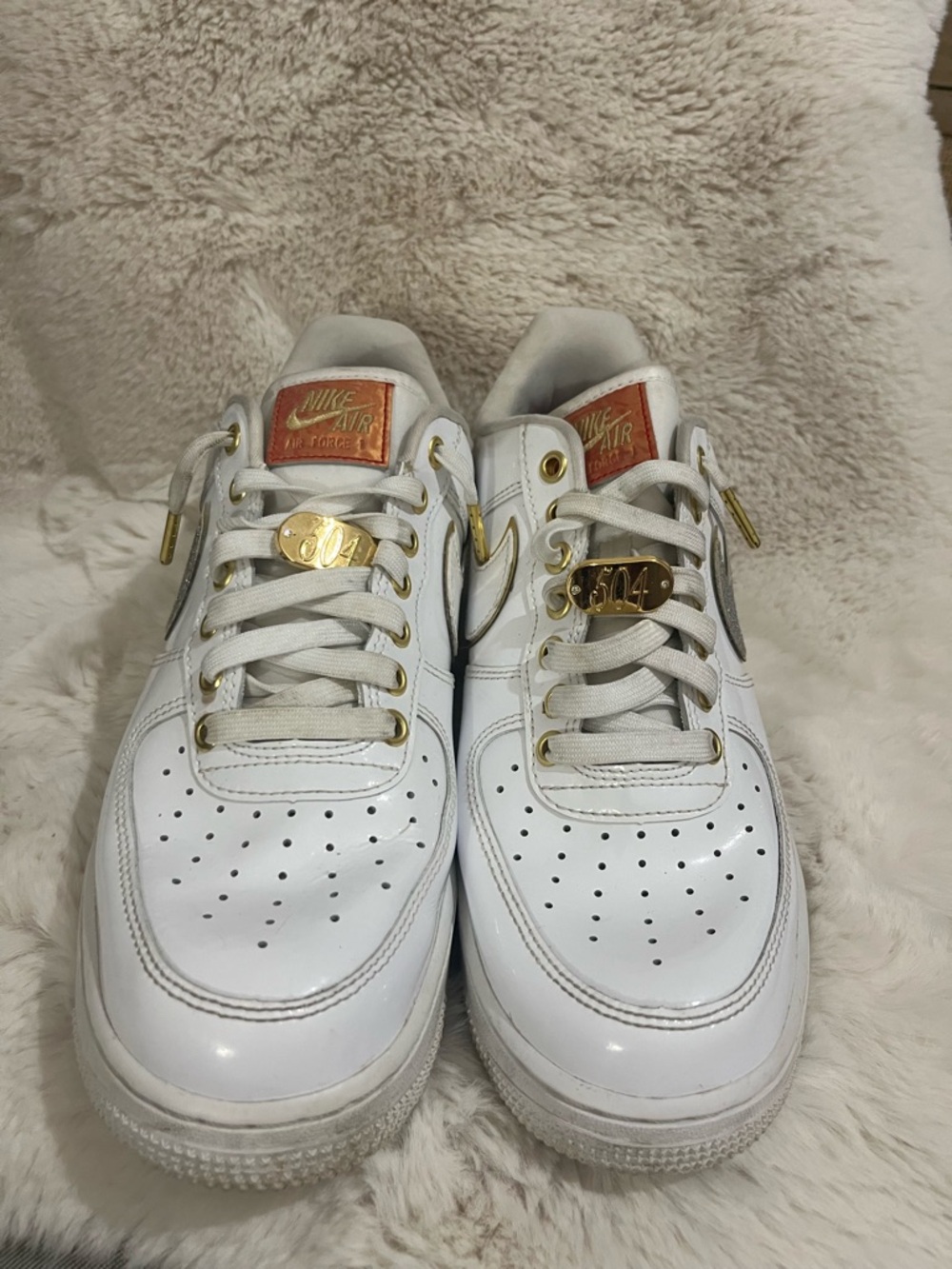 Nike White Leather Sneakers with Gold Accents
